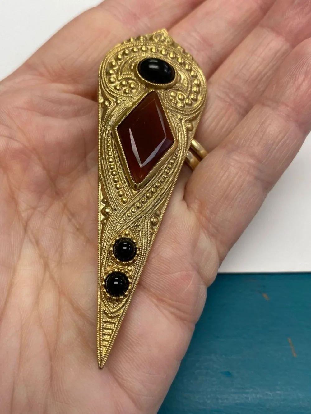 Gold-Tone Filigree Pin with Brown and Black Stones